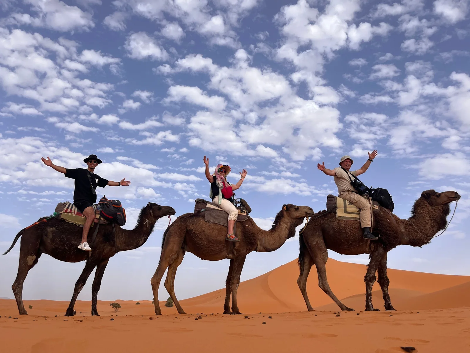 Travelers enjoying their camel experience