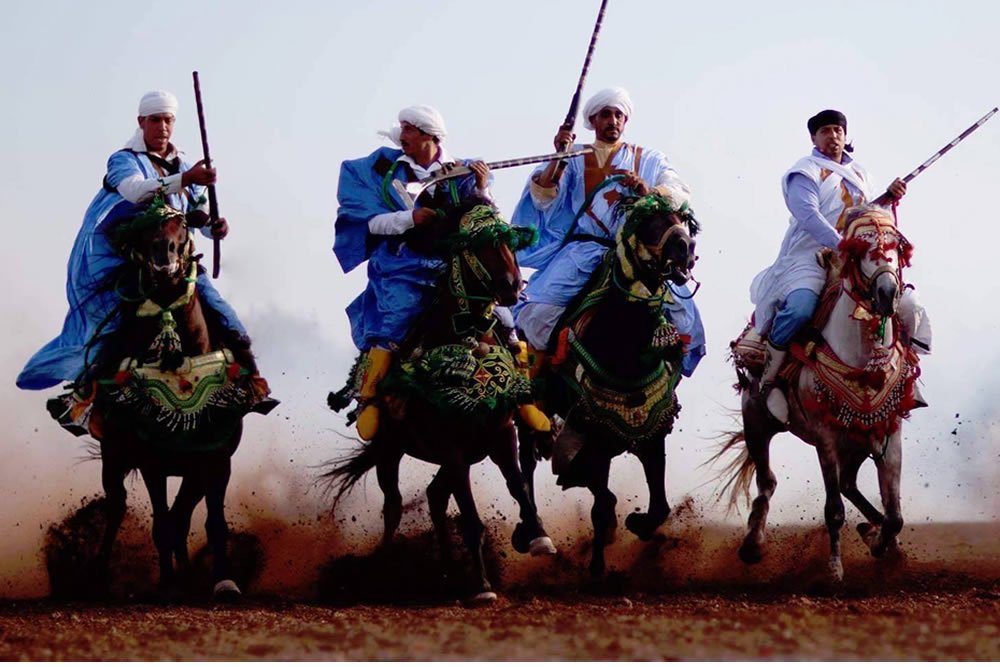 Traditional horse riders taking part in a fantasia display