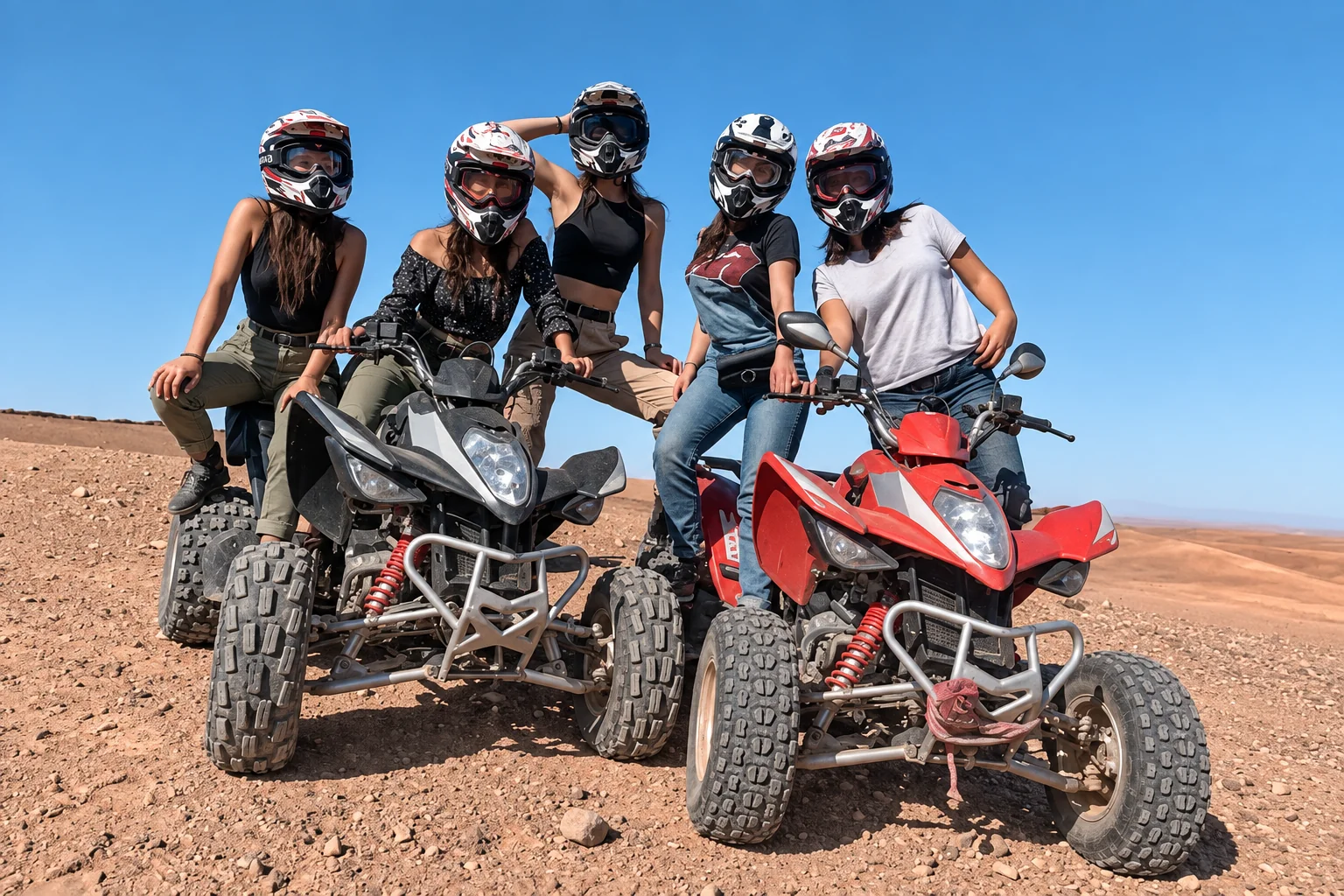 Helmeted group with quad bikes in the Agafay desert