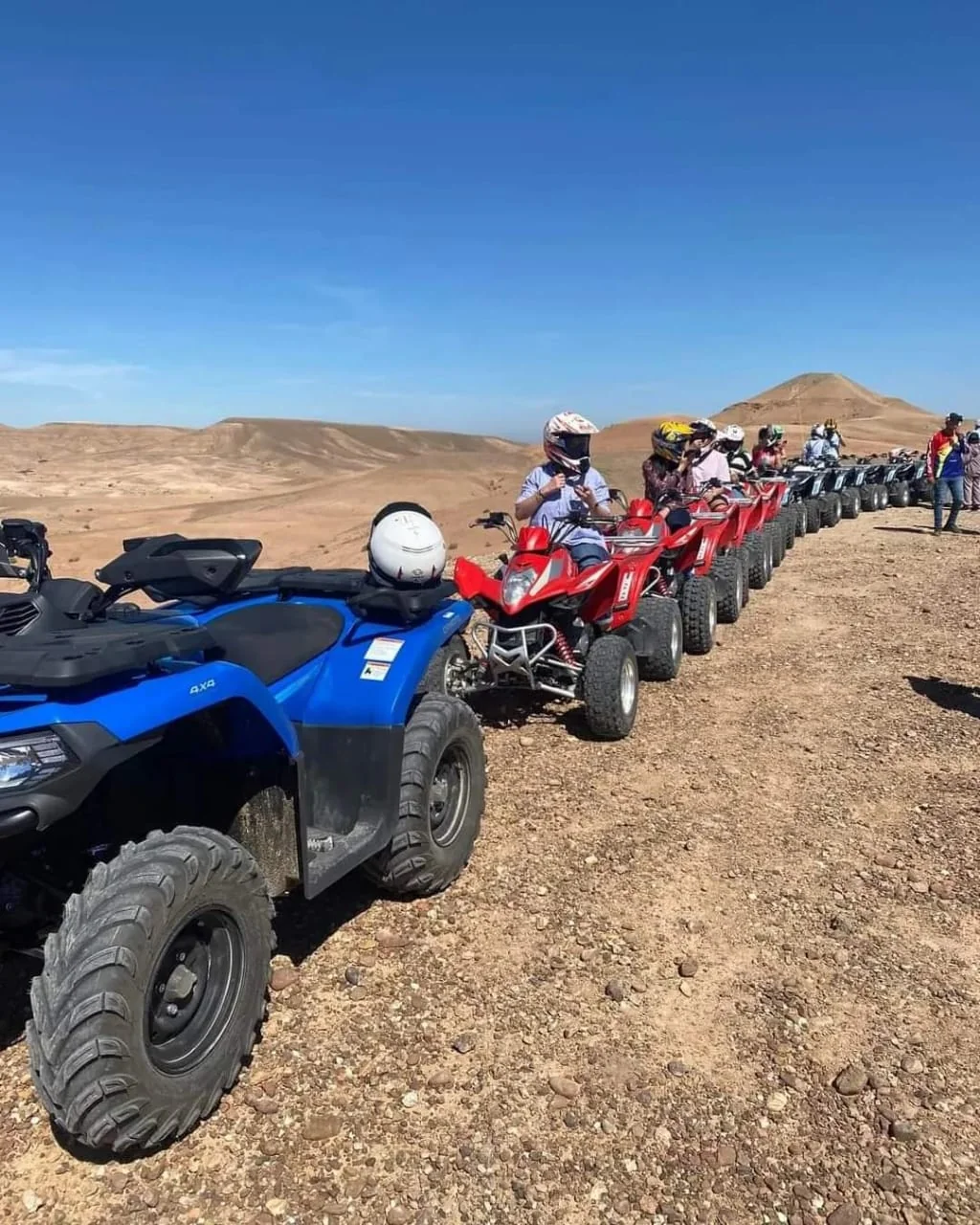 Quad bikes lined up in the desert