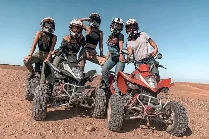 Friends with quad bikes in the desert