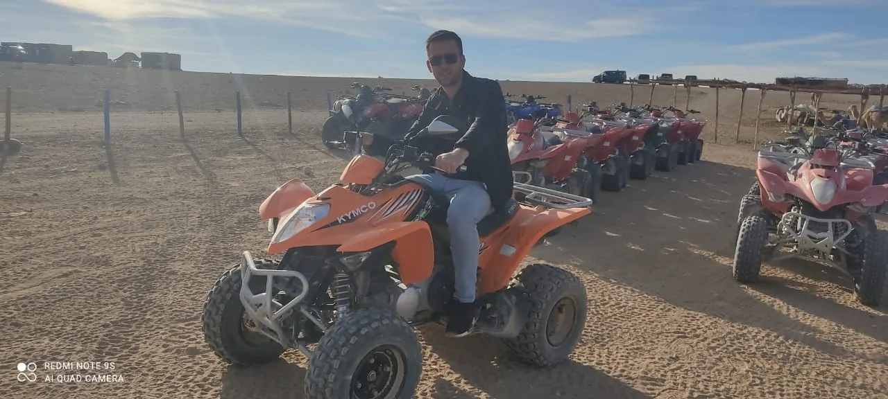 Rider on an orange quad bike