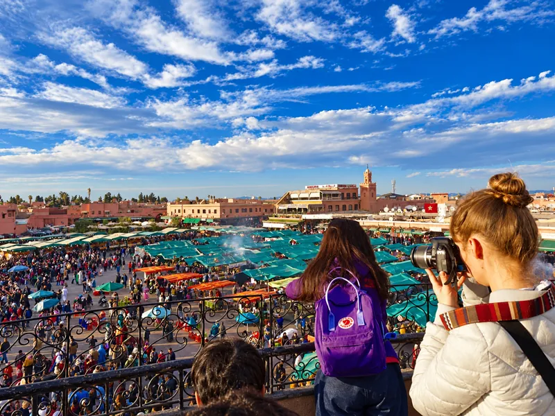 Visitors overlooking Jemaa el-Fnaa square in Marrakech