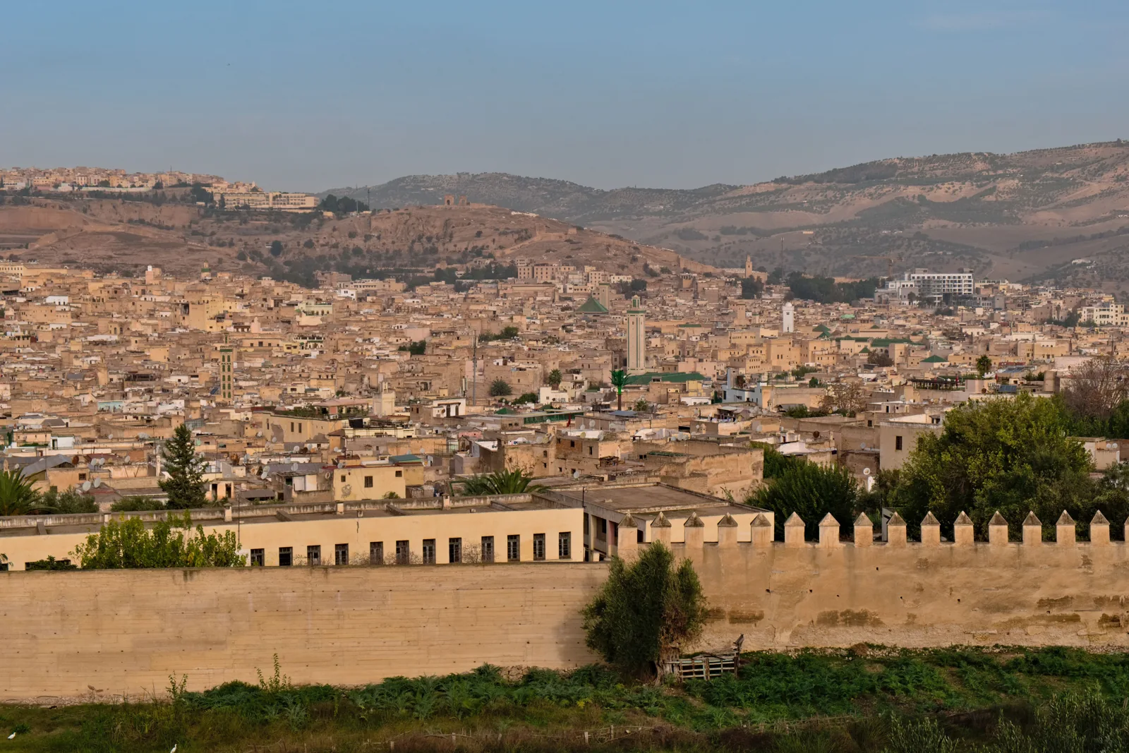 Panoramic view of a Moroccan medina behind historic walls