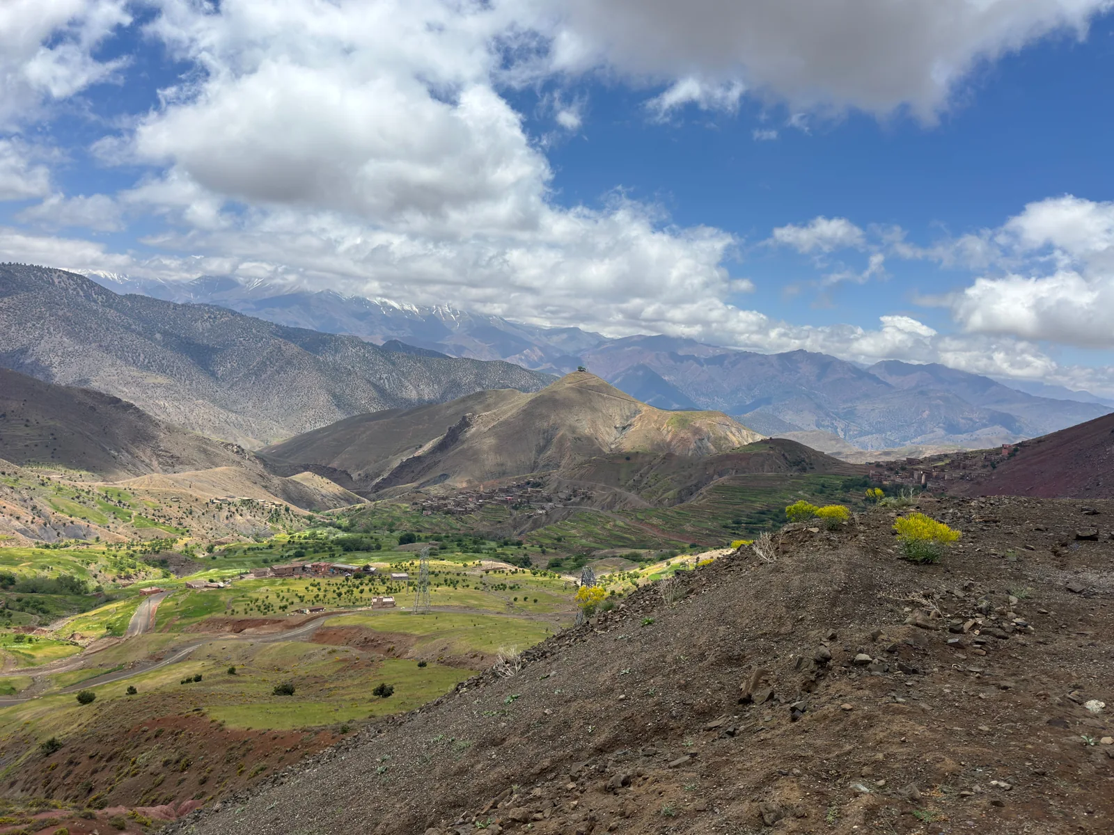 Green valley and villages beneath the Atlas Mountains