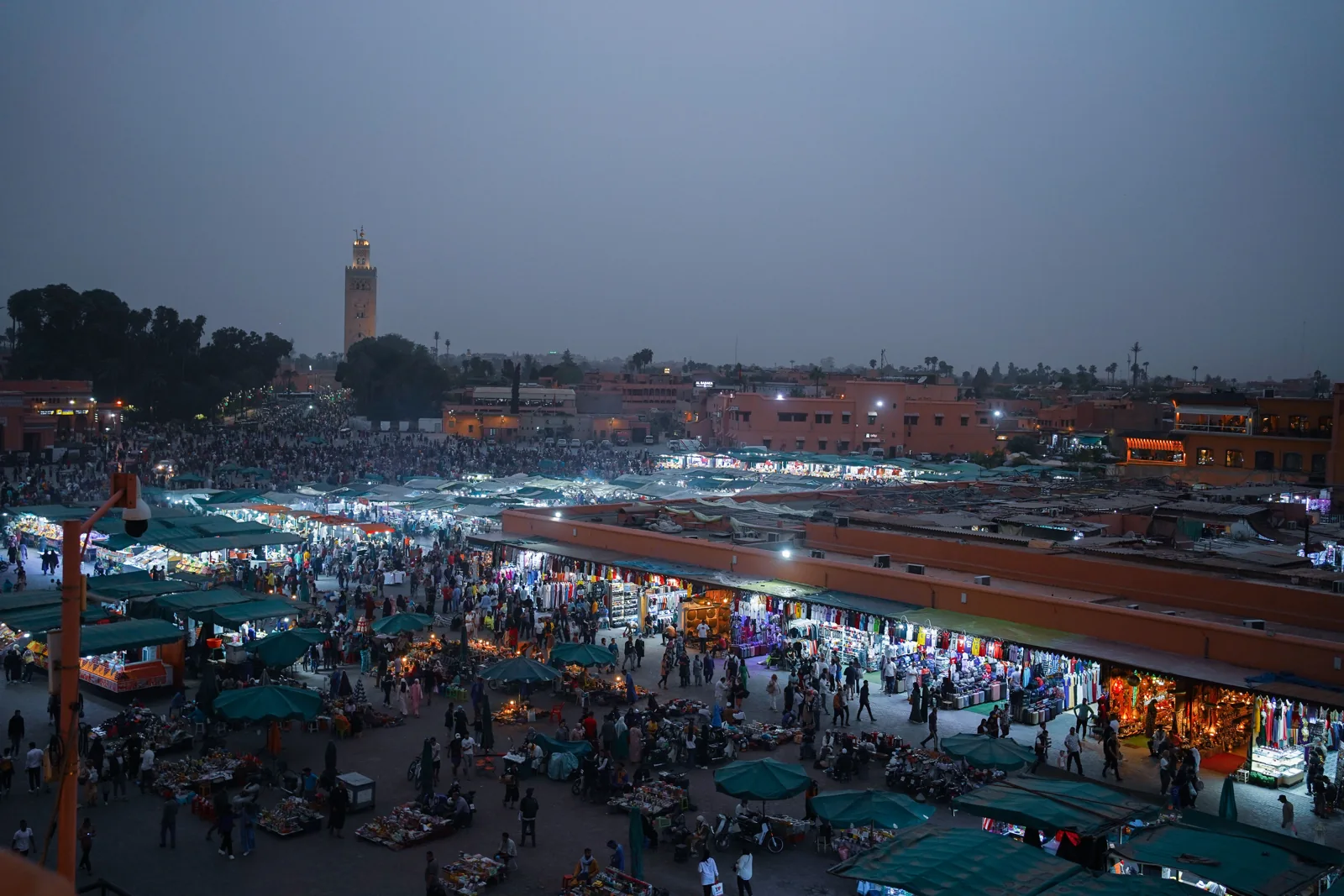 Busy market square in Marrakech at dusk